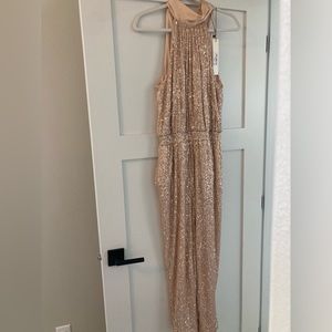 NWT sequence jumpsuit with pockets.